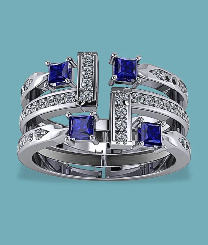 Stylish silver ring with blue gemstones and sparkling accents. Visit Masterpiece Jewelers for fine jewelry in Daytona Beach.