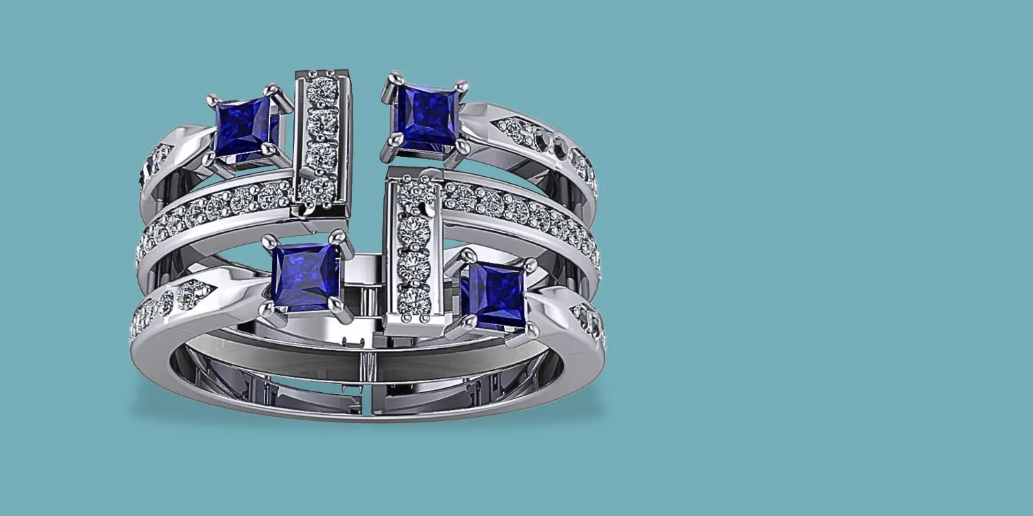 Stylish silver ring with blue gemstones and sparkling accents. Visit Masterpiece Jewelers for fine jewelry in Daytona Beach.