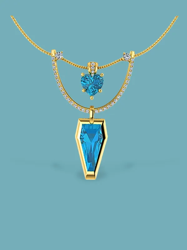 Elegant gold necklace featuring blue gemstones and sparkling accents, perfect for any occasion. Visit Masterpiece Jewelers.