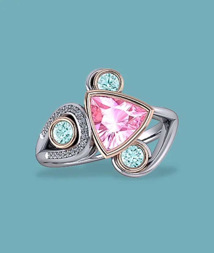 Triangular pink gemstone ring with aqua accents, set in silver and rose gold. Shop at Masterpiece Jewelers in Daytona Beach.