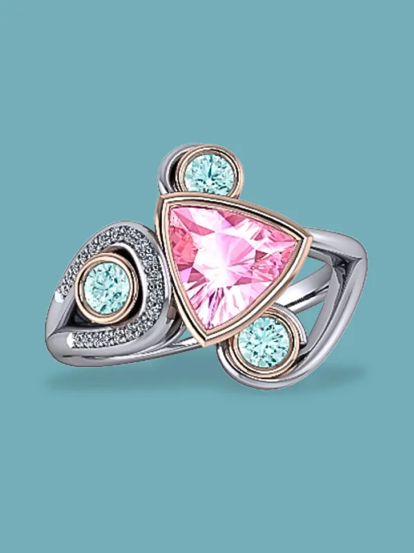 Triangular pink gemstone ring with aqua accents, set in silver and rose gold. Shop at Masterpiece Jewelers in Daytona Beach.