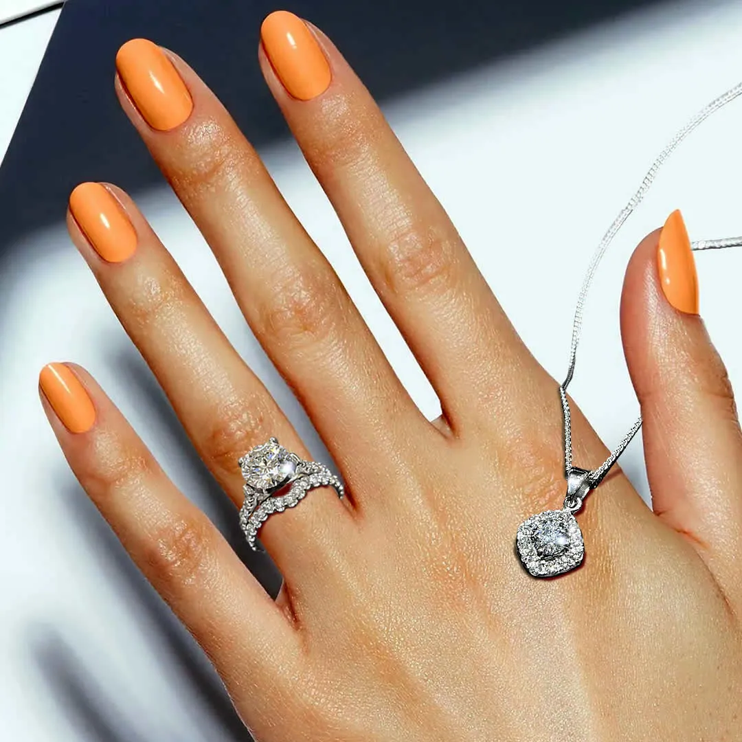 large diamond center stone engagement ring with halo style pendant on woman's hand