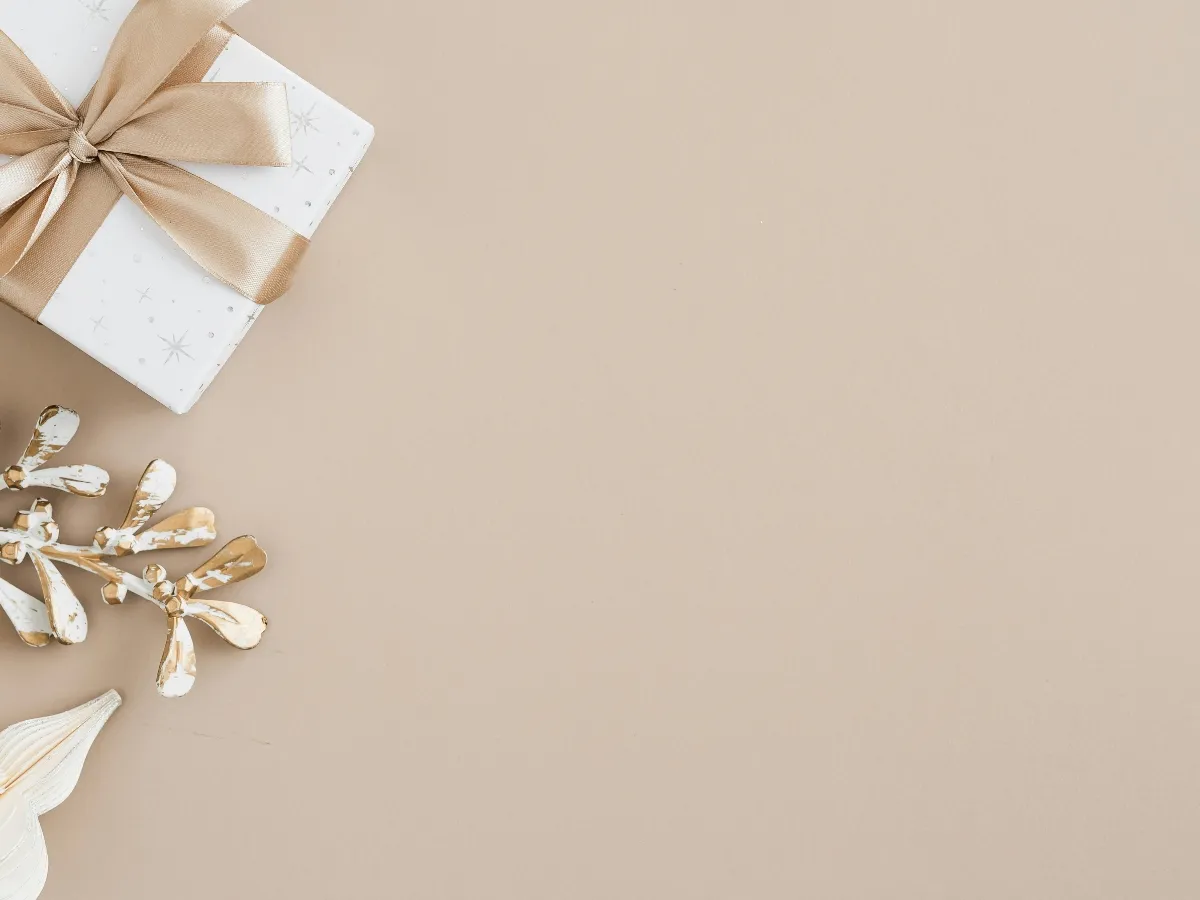 Gift box with golden ribbon.