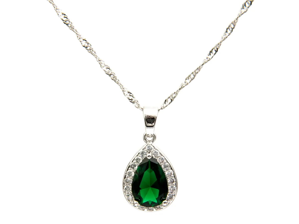 Teardrop emerald pendant on silver chain.