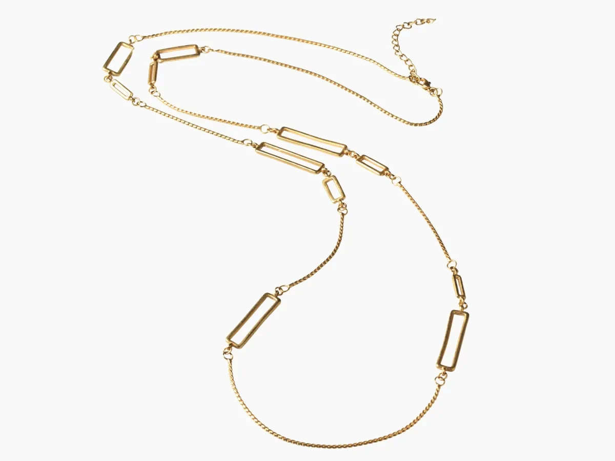 Long gold necklace with rectangular links.