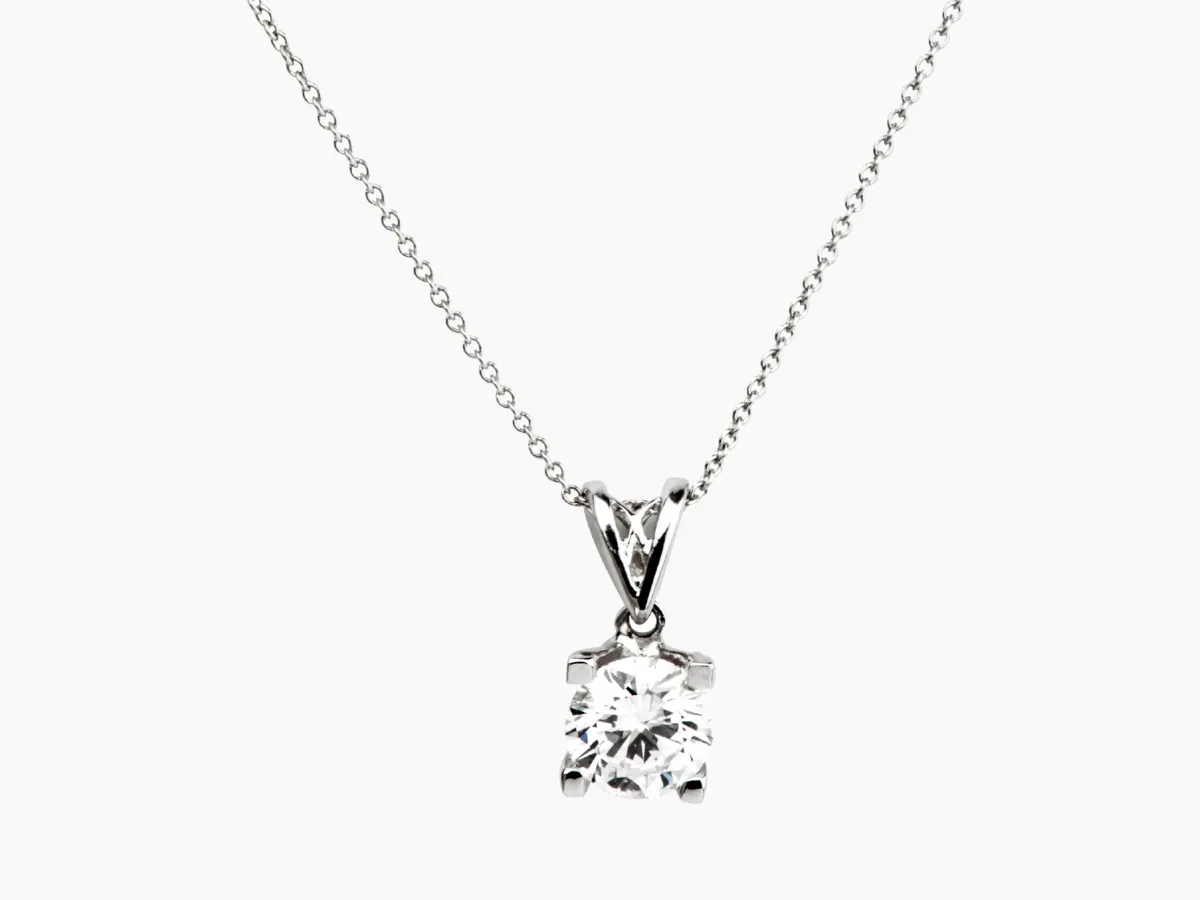 Classic solitaire diamond pendant on chain.