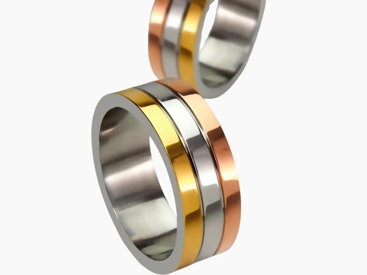 Trio-tone metal rings in gold, silver, rose gold.