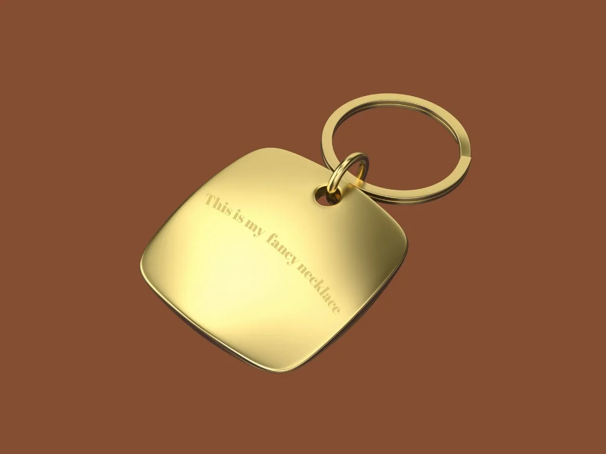 Gold square necklace with engraving.