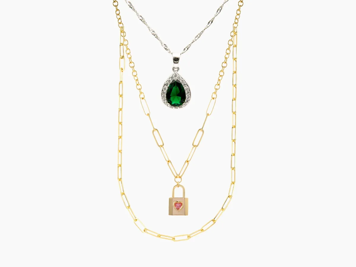 Green gemstone, gold and silver layered pendant necklaces.