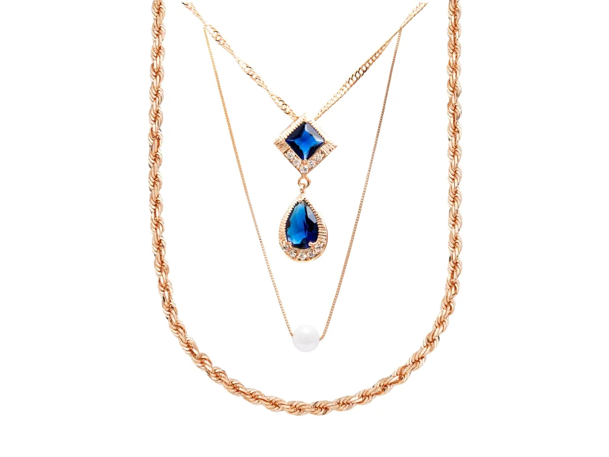 Blue gemstone and pearl layered necklaces.