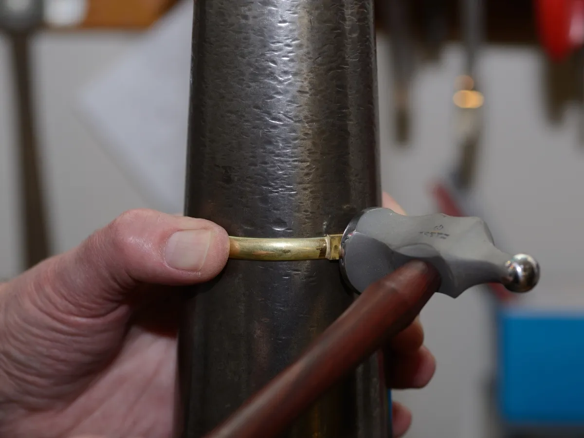 Measuring bracelet size on mandrel.