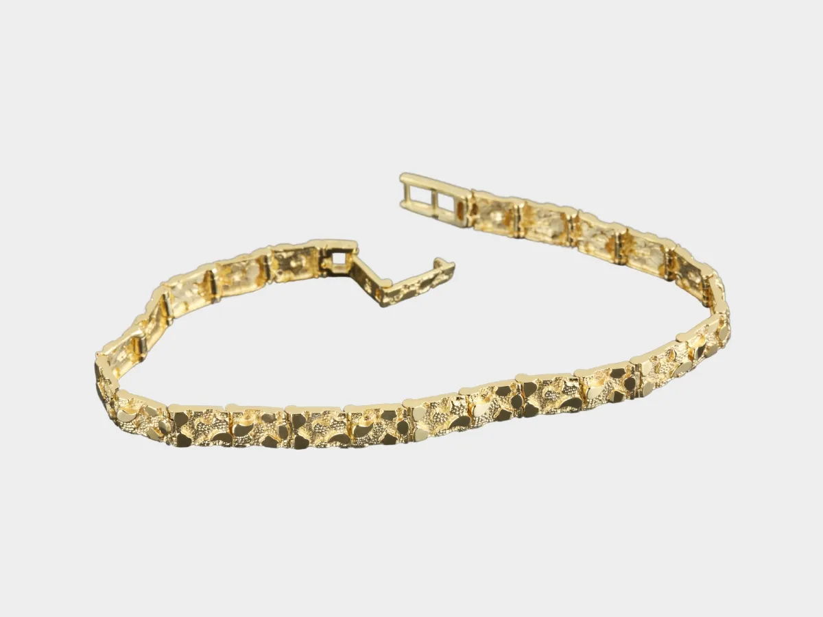 Ornate gold link bracelet.