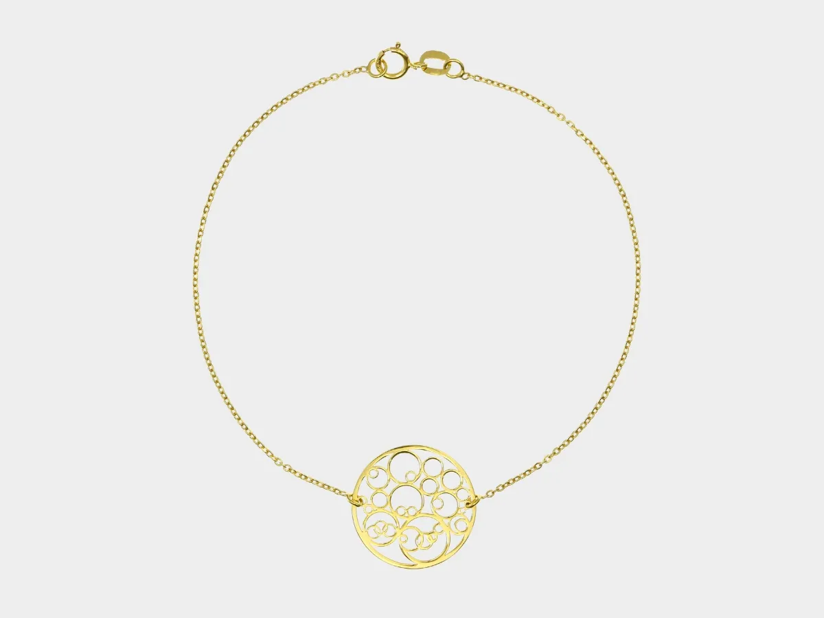 Delicate gold bracelet with filigree.