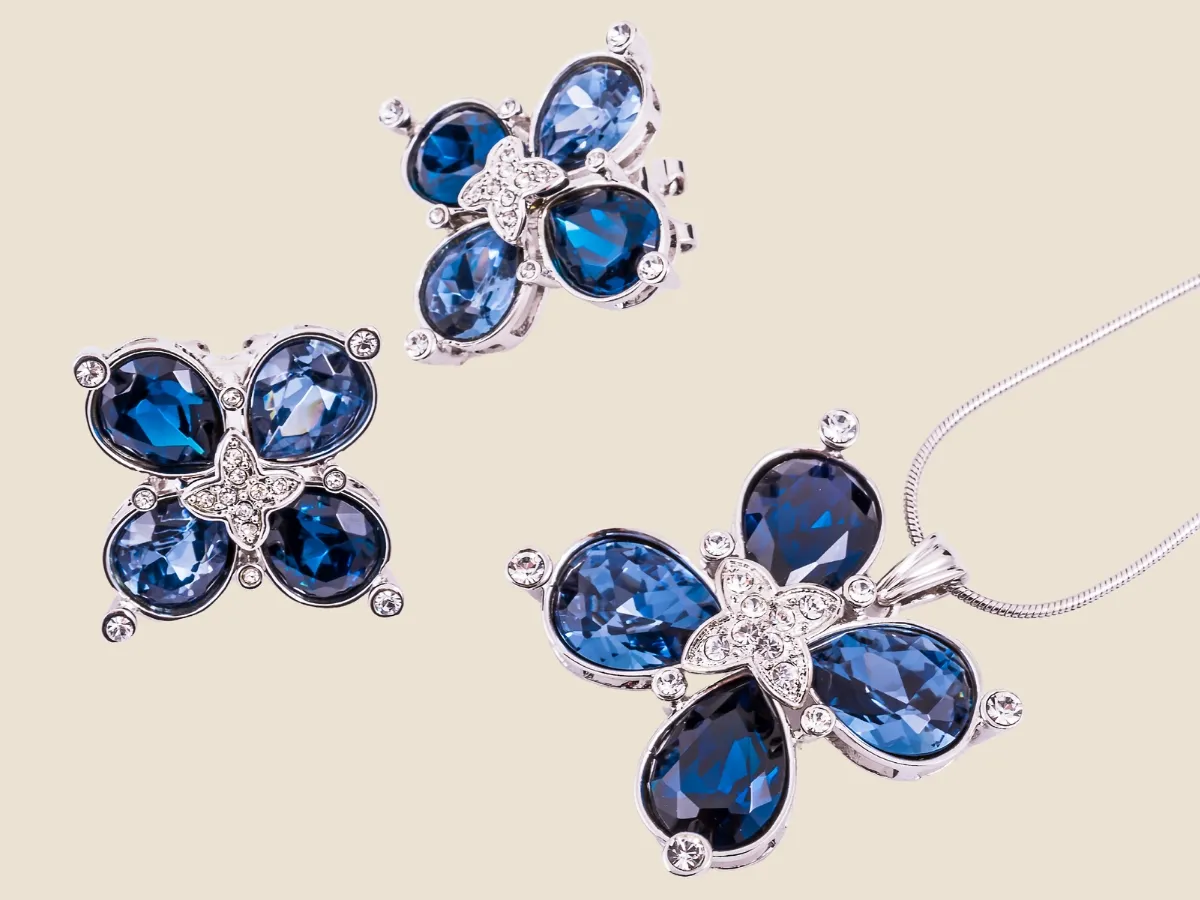 Blue gemstone jewelry set with diamonds.