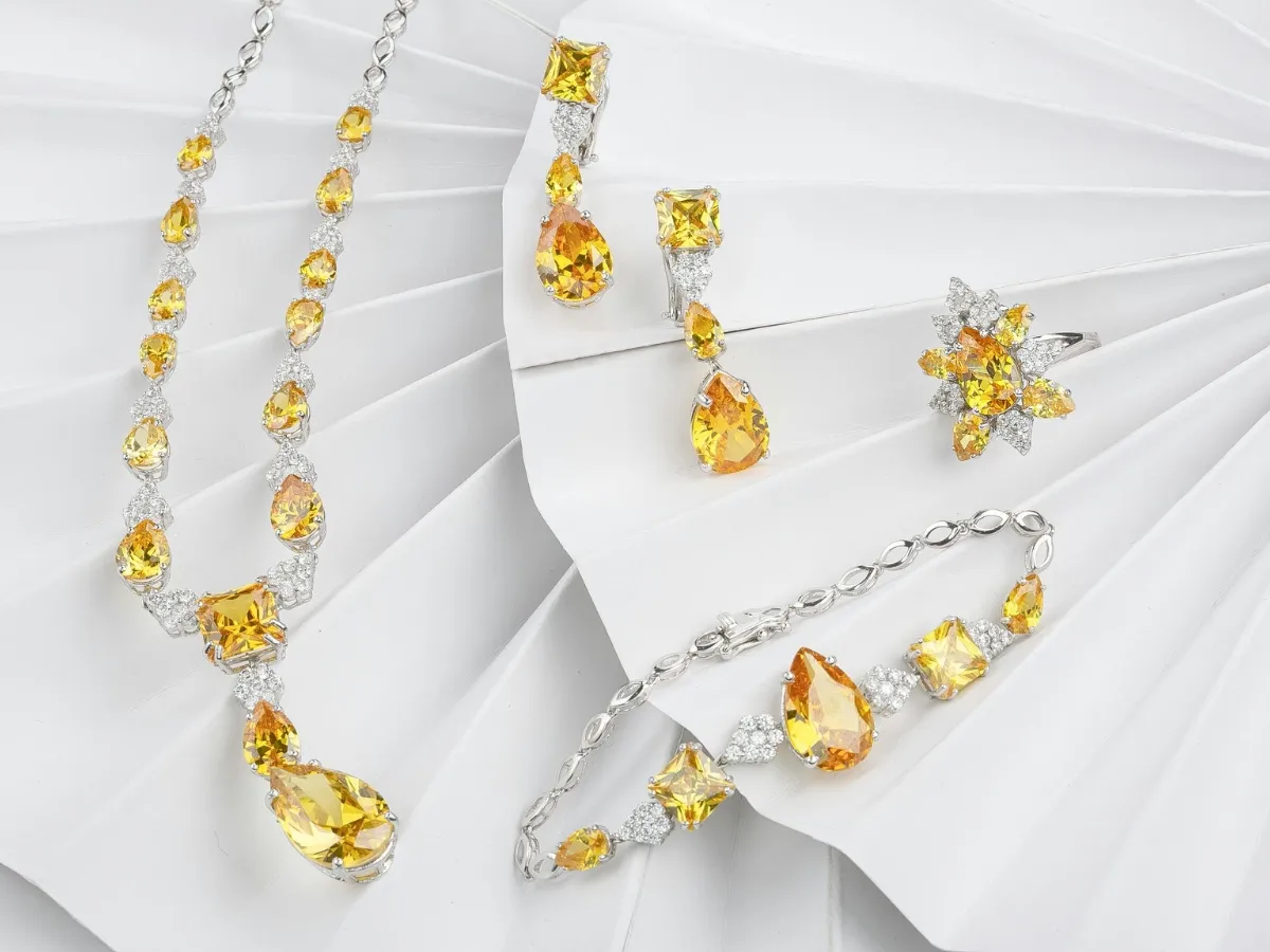 Yellow gemstone jewelry set with diamonds.