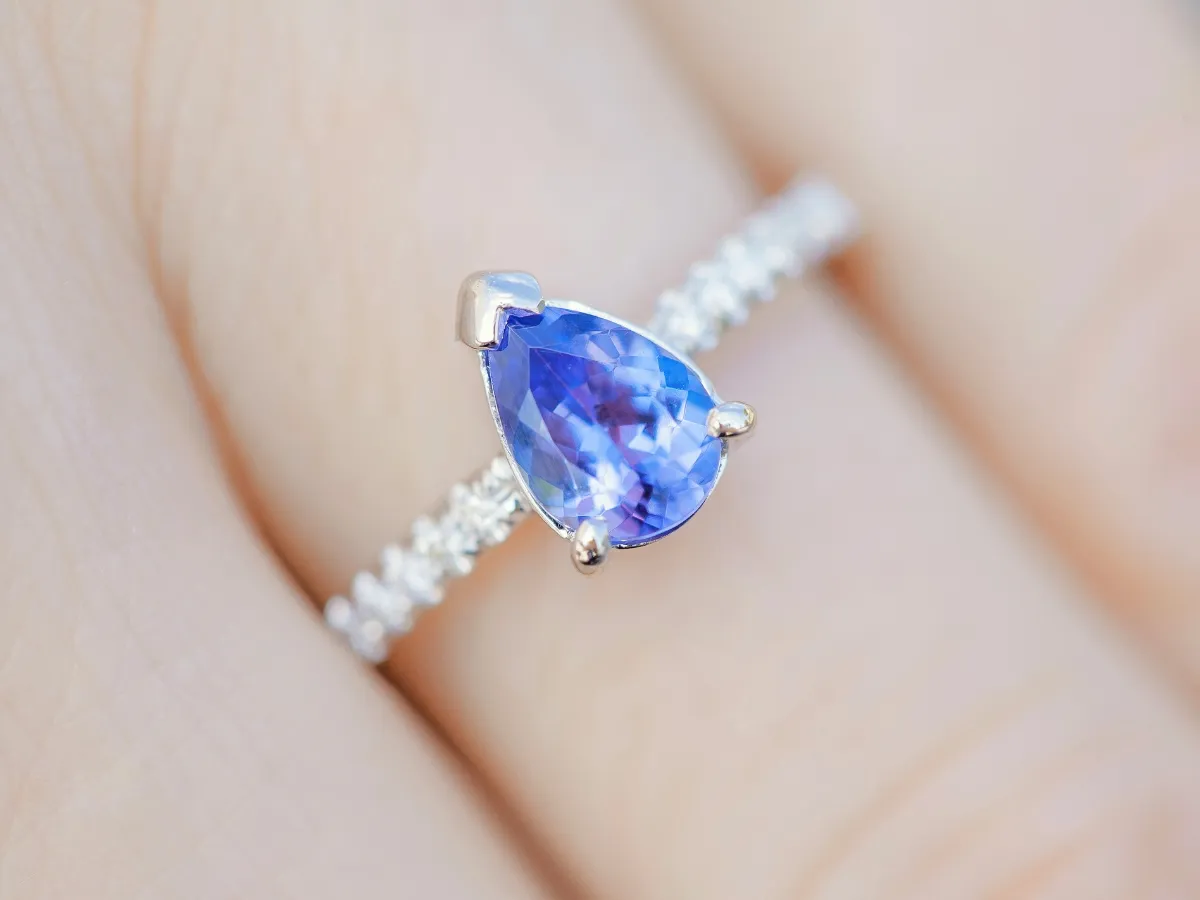 Close-up of sapphire engagement ring.