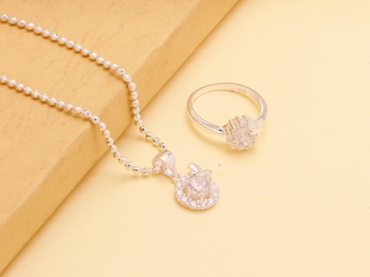 Silver necklace and diamond ring.