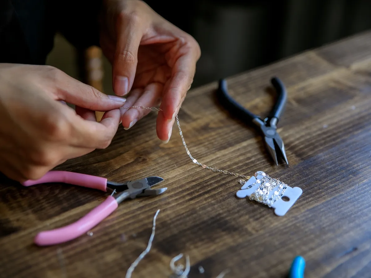 Handmade jewelry crafting with pliers.