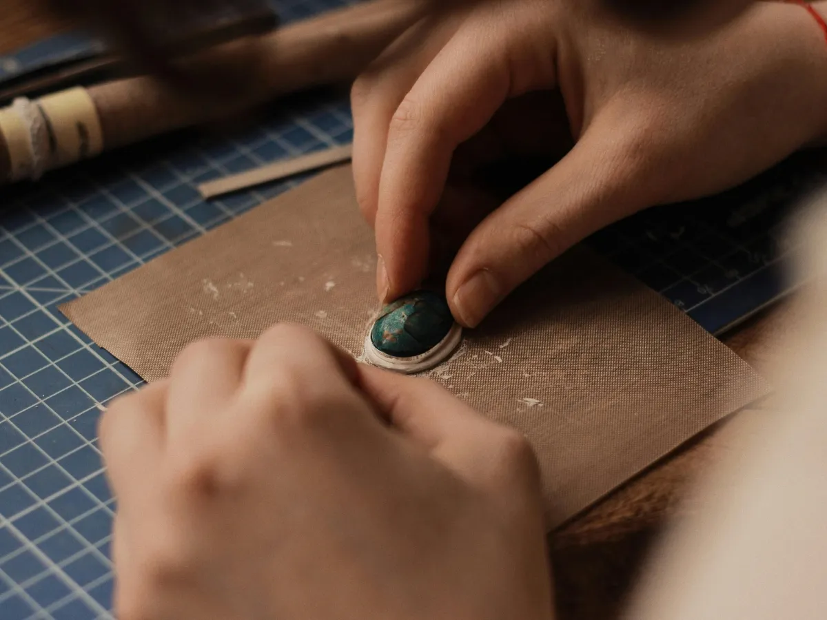 Setting turquoise stone in bezel.