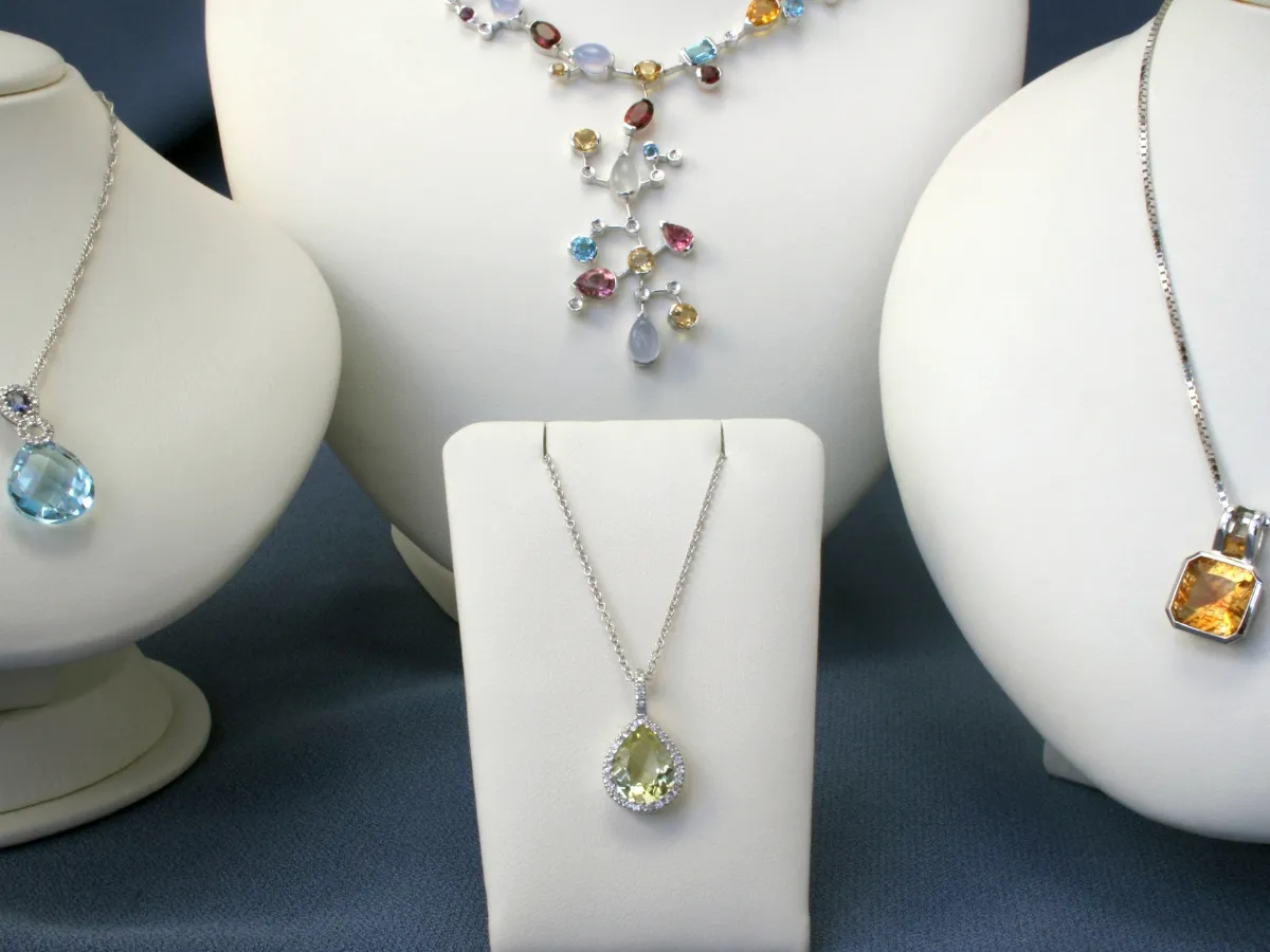Display of gemstone pendant necklaces.