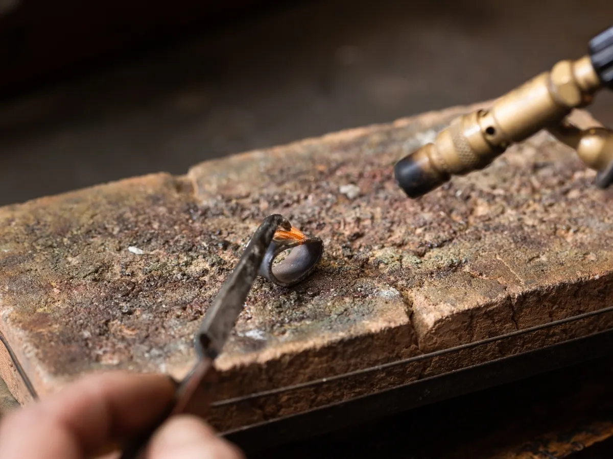 Soldering ring on workbench.
