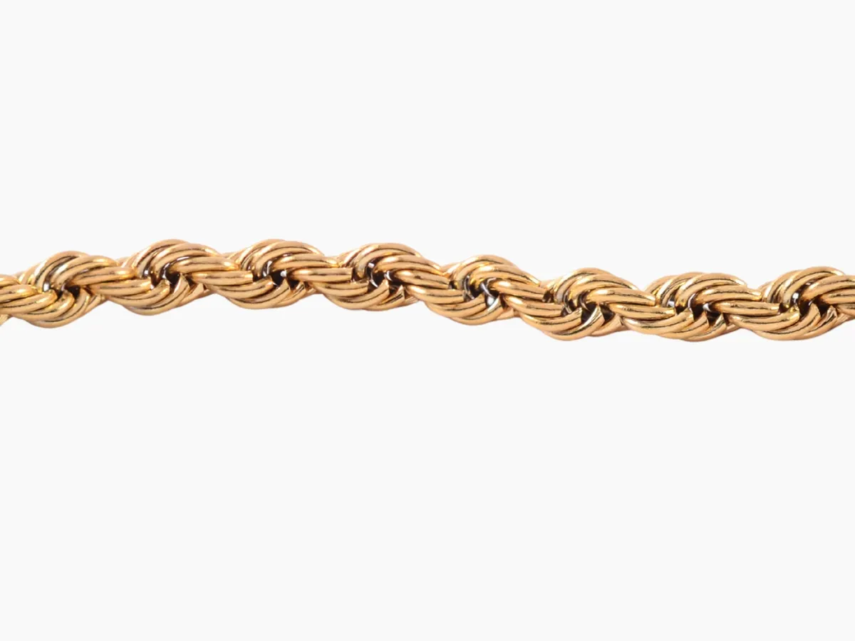 Twisted gold rope chain close-up.