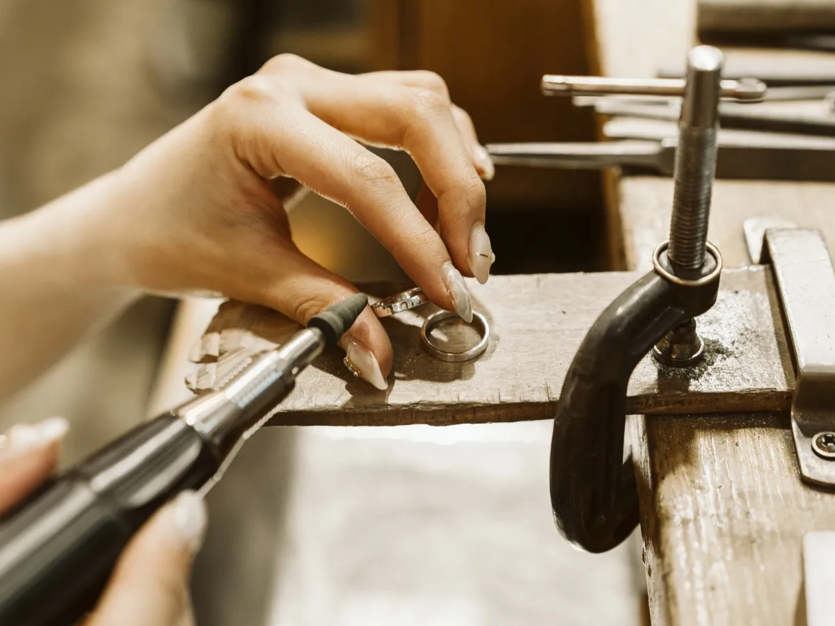 Hand crafting a jewelry ring.
 