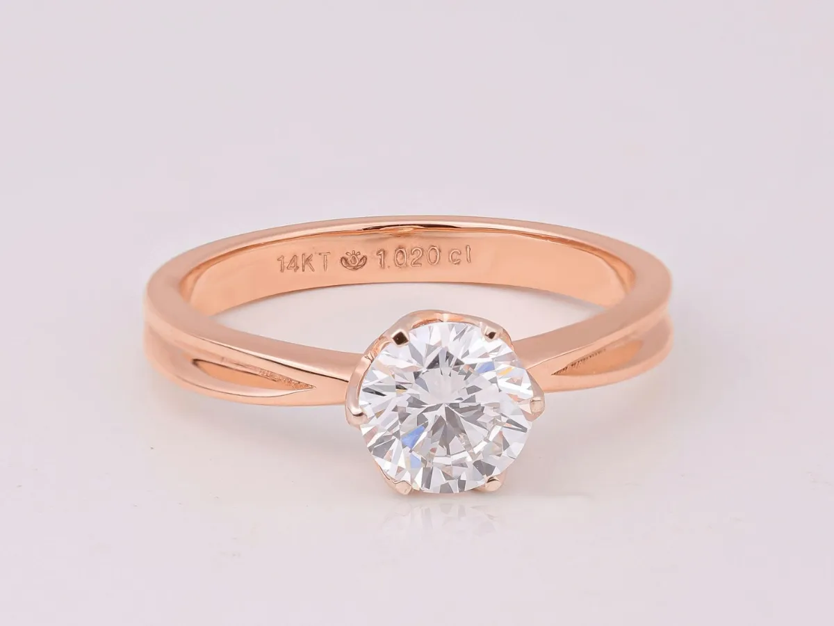 14K rose gold solitaire ring.
