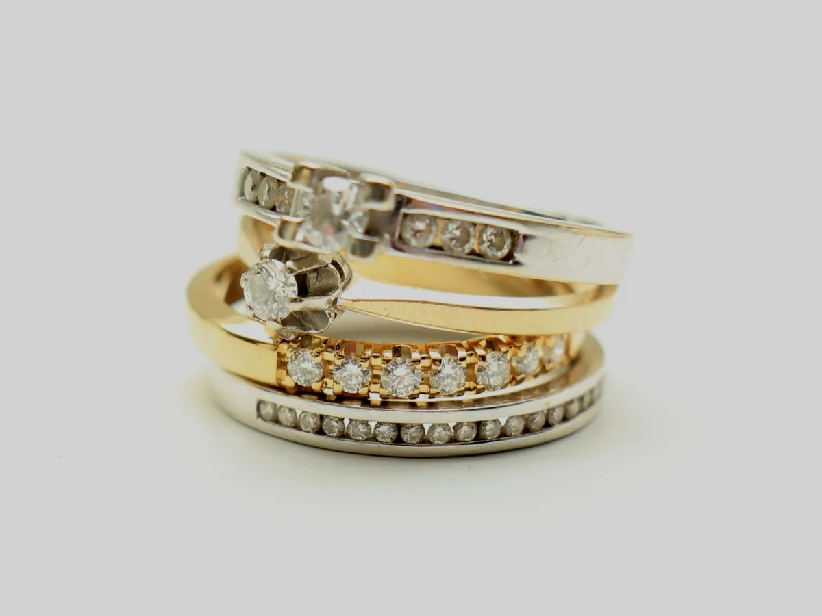 Stack of gold and silver rings.