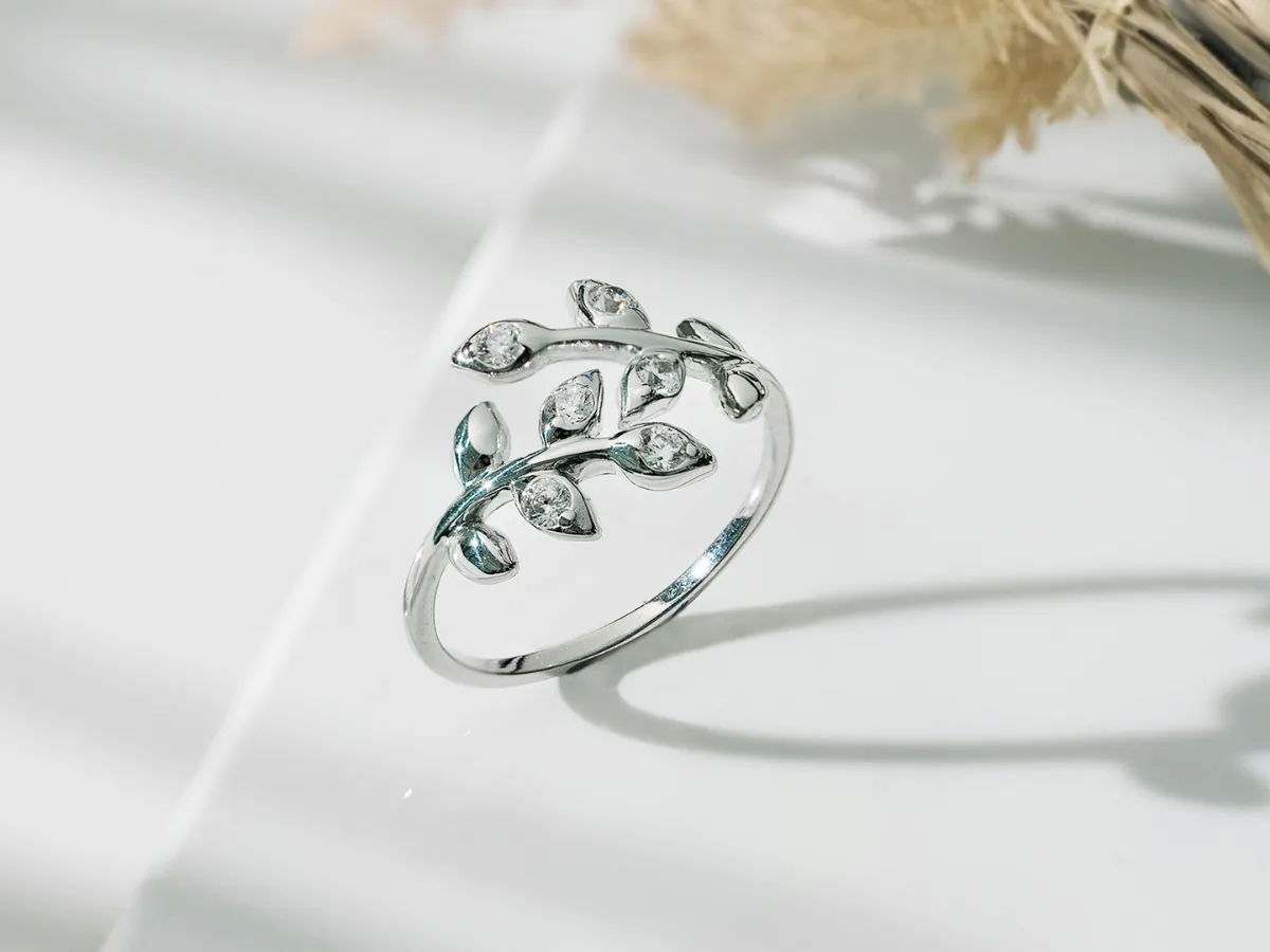 Sterling silver ring with leaf design and diamonds.