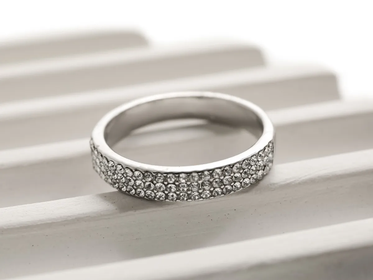 Silver ring with a band of sparkling diamonds.