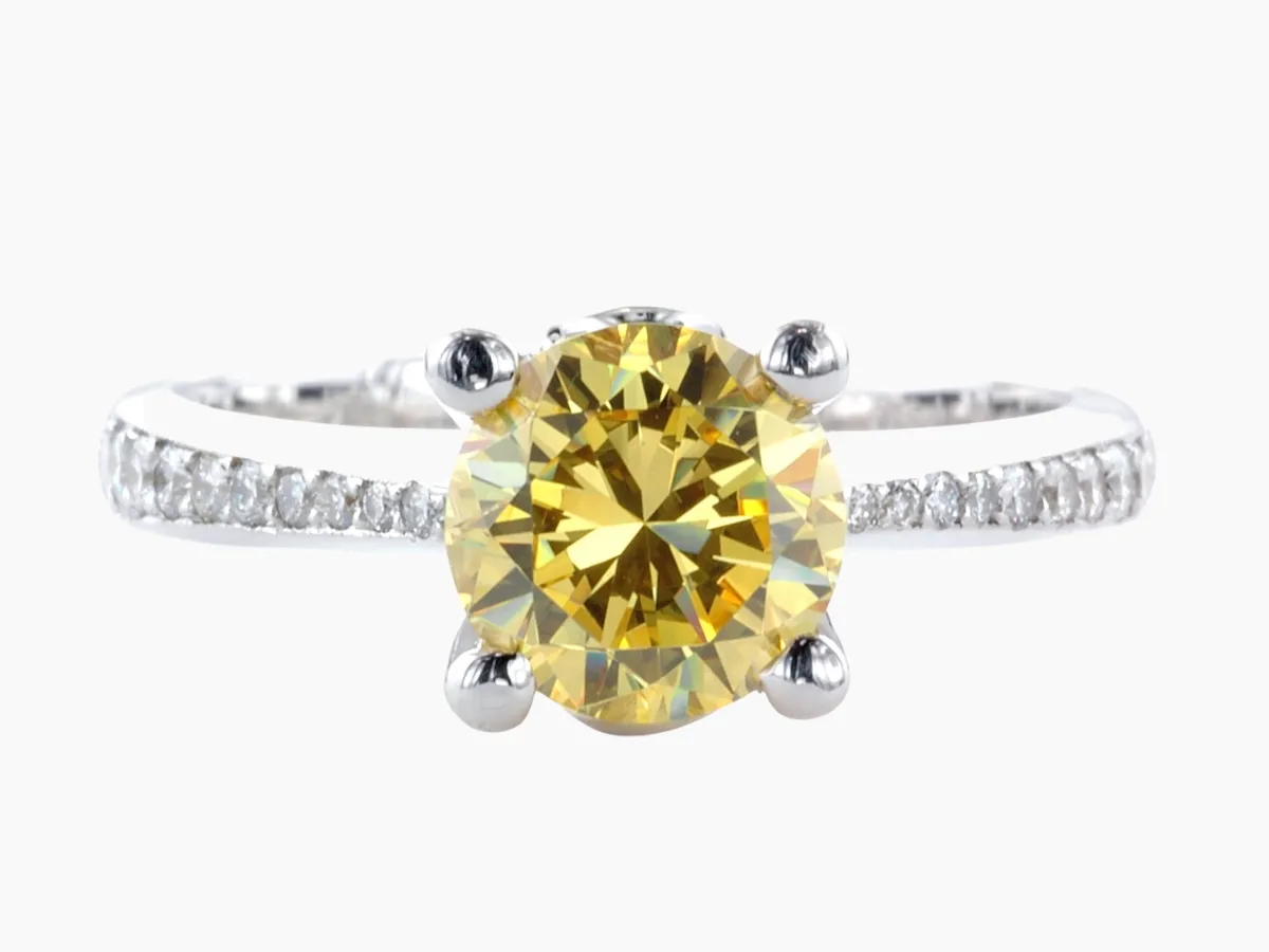 Solitaire-style ring with a diamond-accented band.