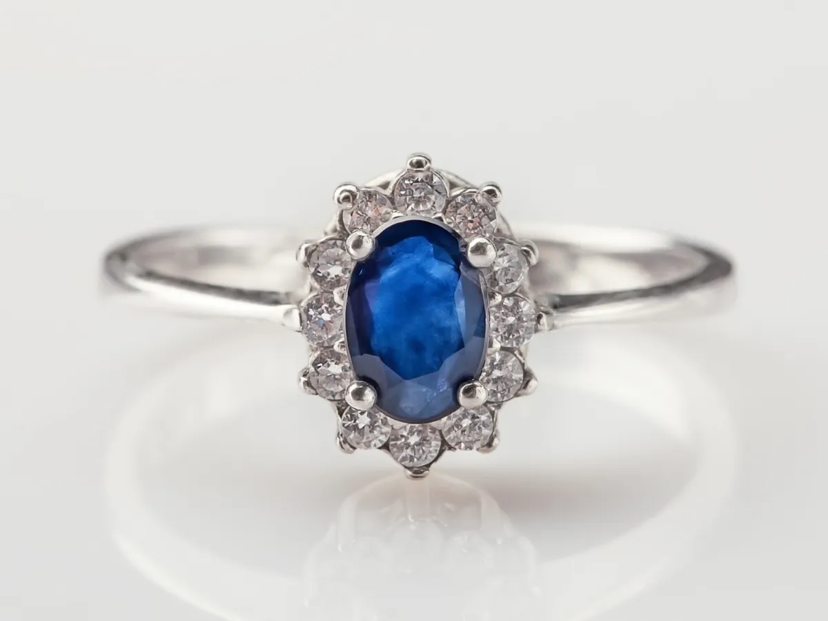 Sapphire and diamond halo engagement ring.