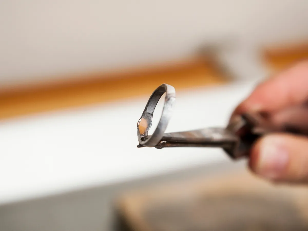 Close-up of handmade silver ring detail.