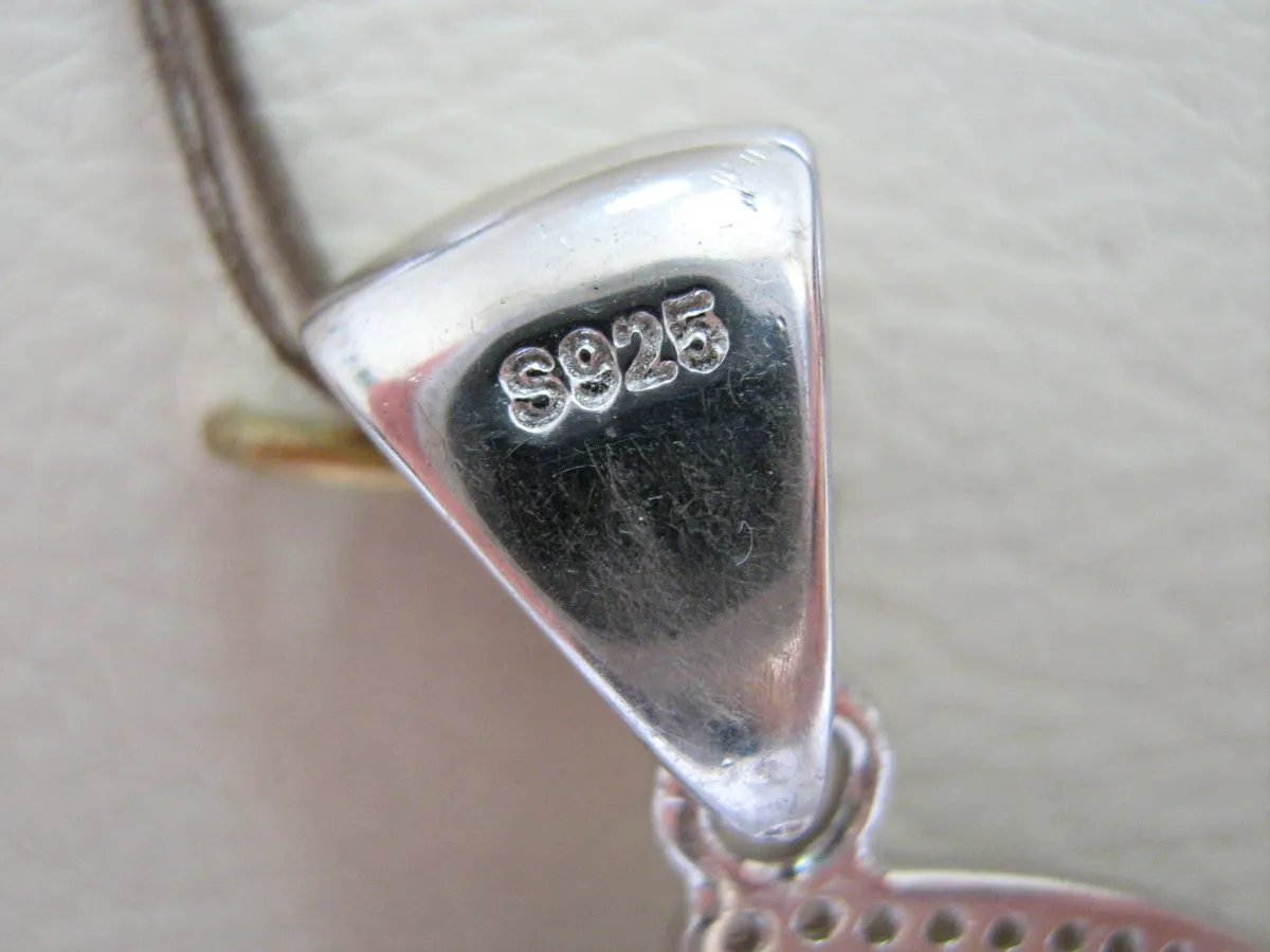 Close-up of silver jewelry hallmark S925.