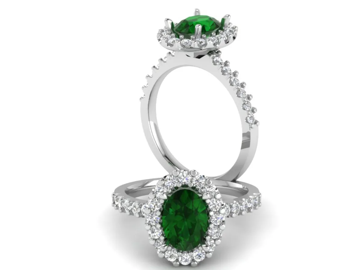  Emerald and diamond halo engagement ring.

