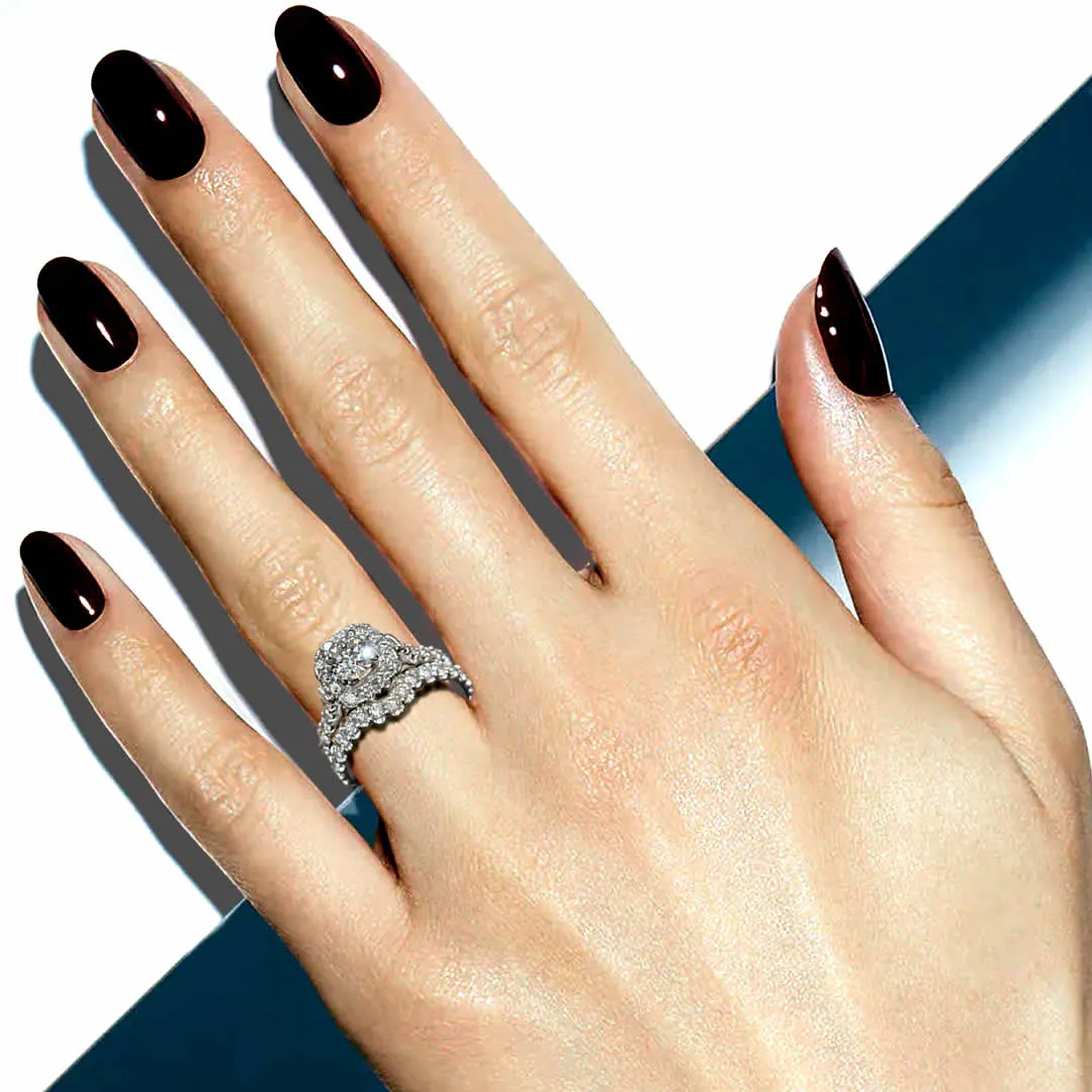 Halo style engagement ring on woman's hand