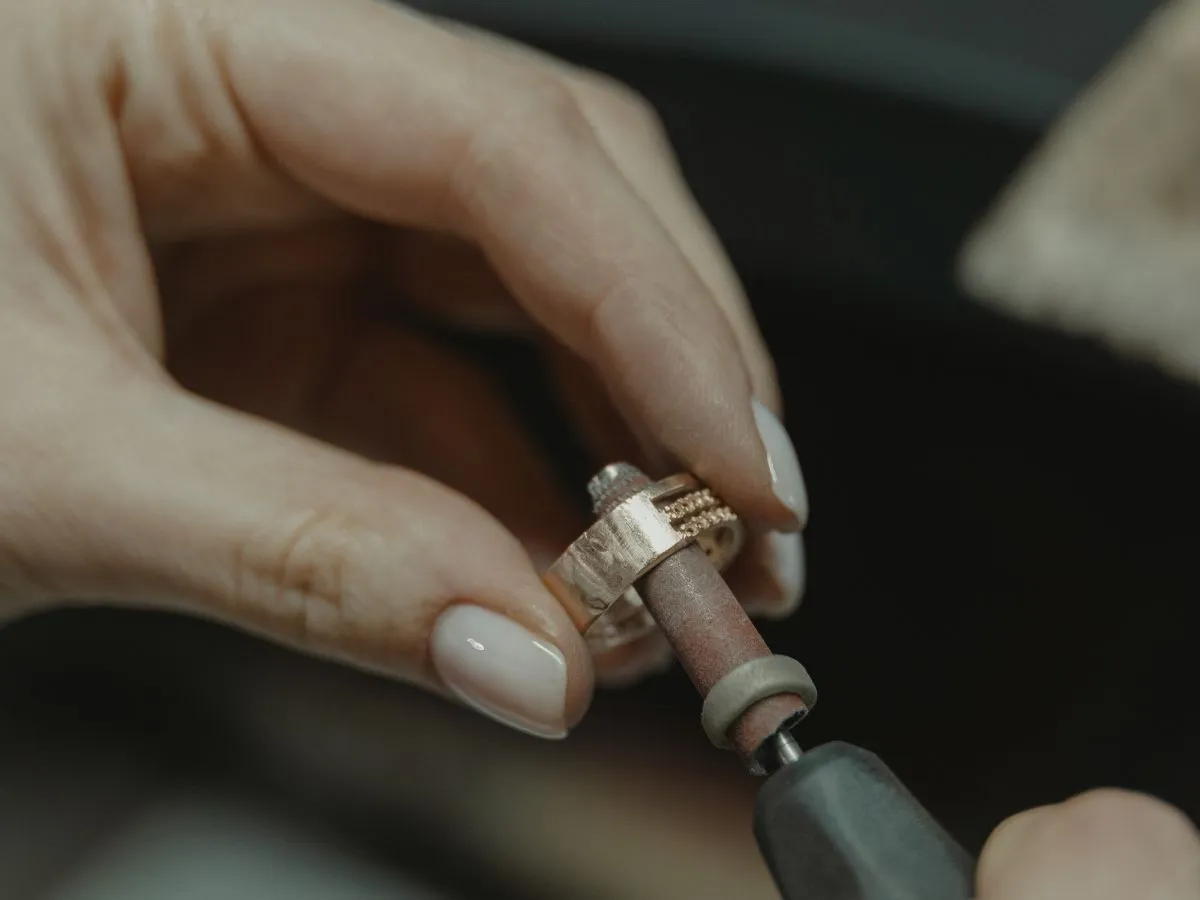 Close-up of ring being polished.