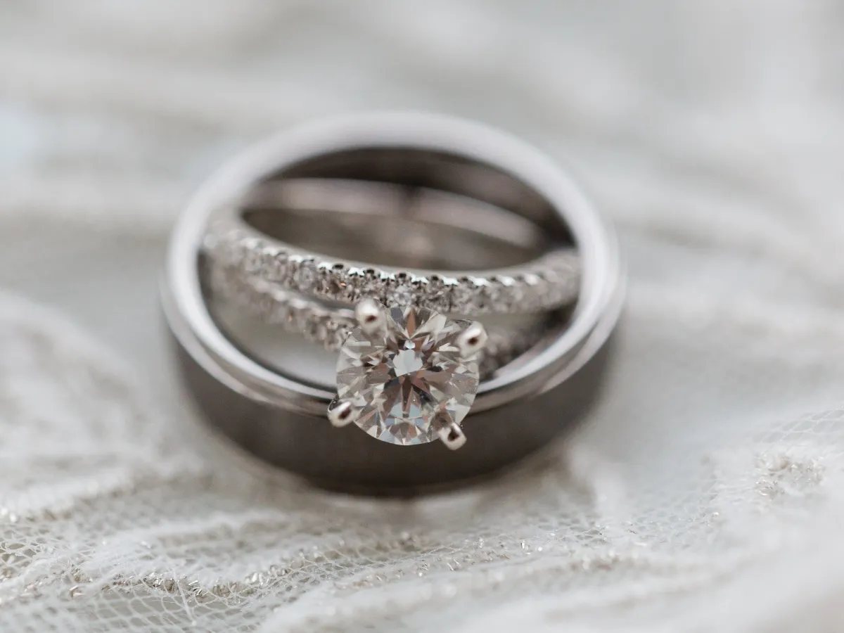 A diamond engagement ring with matching pavé wedding band.