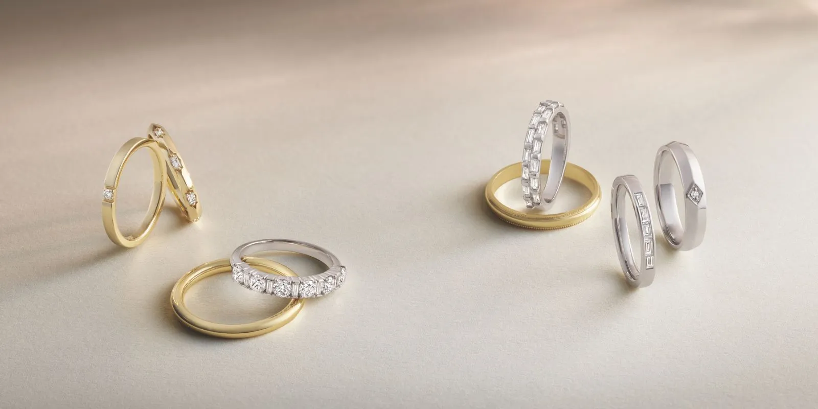 Four elegant diamond engagement rings featuring rose gold bands, with round-cut diamonds and intricate settings, including one w
