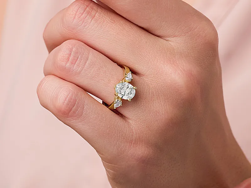 Woman wearing an oval engagement ring