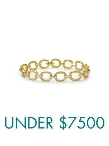 Two elegant bracelets, one gold and one silver, displayed on a wrist. Click to shop all bracelets at Ware's Jewelers.