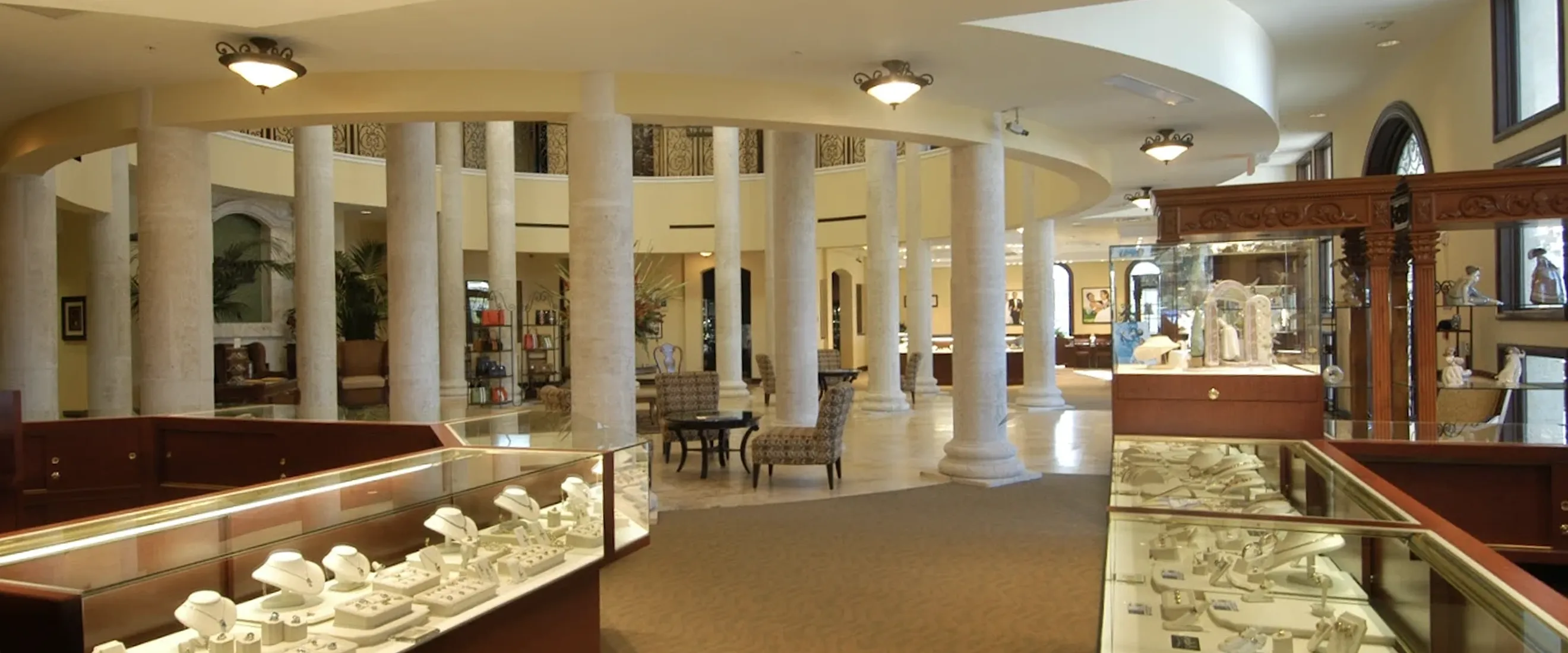 Exterior of the Wesche Jewelers building with palm trees.