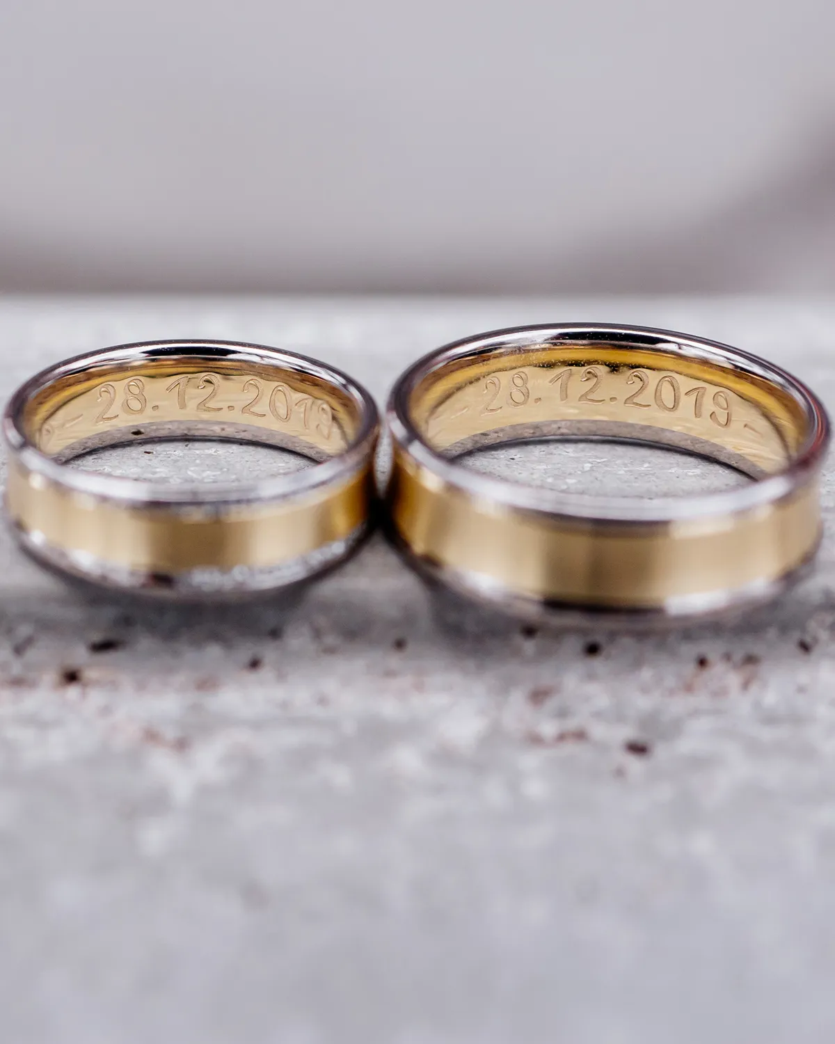 Two gold rings with engraved date 