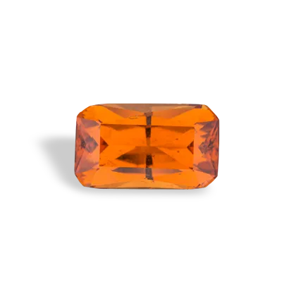 Rectangular orange gemstone, likely a spessartite garnet, on a white background.