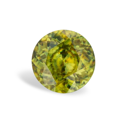 A round, faceted yellow-green sphene gemstone with a shadow on a white background.