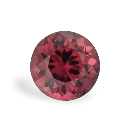 A round, faceted red gemstone with a dark center, displayed on a white background.