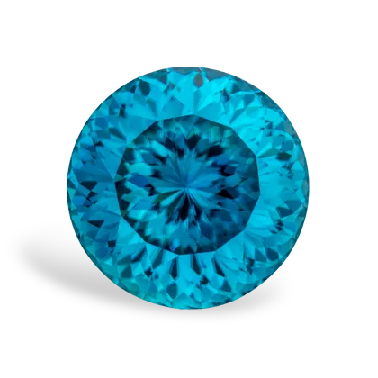 A vibrant blue zircon gemstone with intricate facets on a white background.