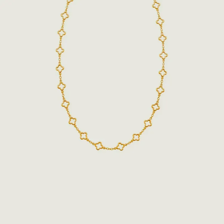 Gold necklace with clover-shaped links, perfect for elegant jewelry styling.
