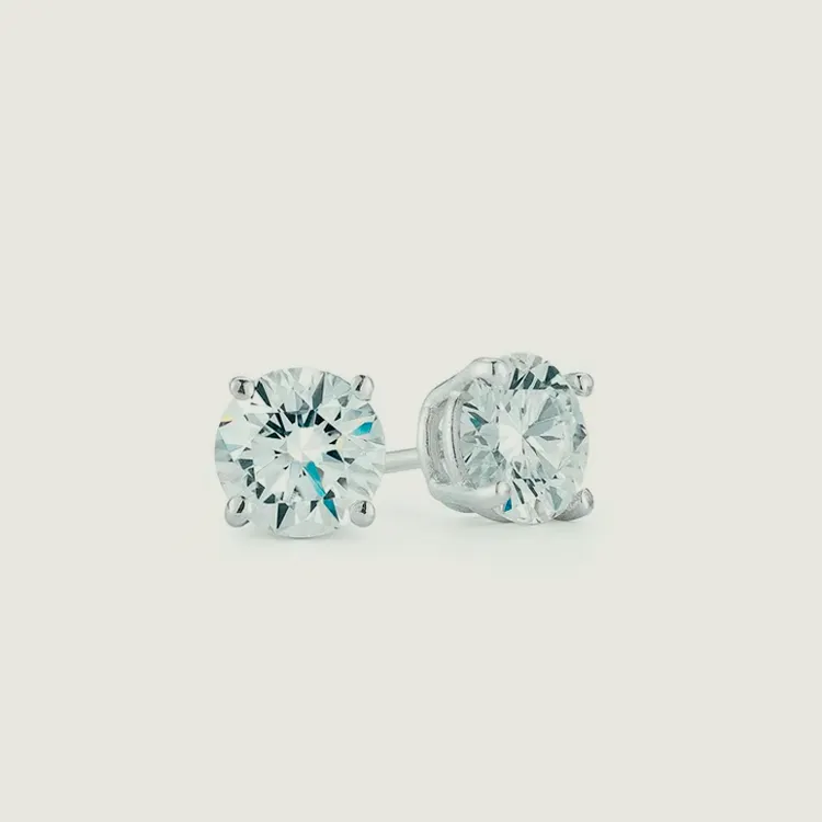 Lab diamond stud earrings with a classic round cut, set in a sleek silver setting.